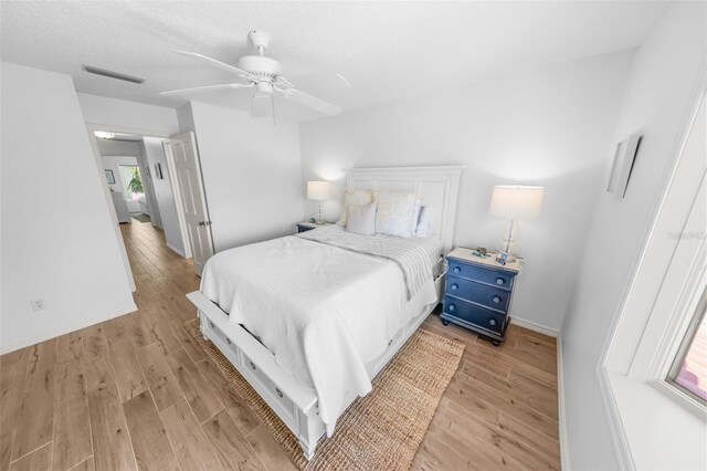 2961 Oceans Trce, Daytona Beach Shores, FL 32118 - bedroom with light wood-style floors, baseboards, and a ceiling fan