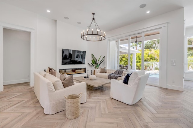 102 Inlet Shores Dr, New Smyrna Beach, FL 32168 - living area with baseboards, a chandelier, and recessed lighting