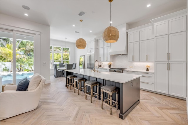 102 Inlet Shores Dr, New Smyrna Beach, FL 32168 - kitchen with built in fridge, recessed lighting, stove, light countertops, and a large island