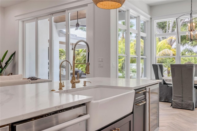 102 Inlet Shores Dr, New Smyrna Beach, FL 32168 - kitchen with dishwasher, a sink, decorative light fixtures, and healthy amount of natural light