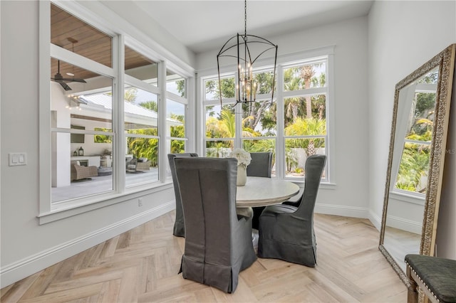 102 Inlet Shores Dr, New Smyrna Beach, FL 32168 - dining space with baseboards, a chandelier, and a ceiling fan
