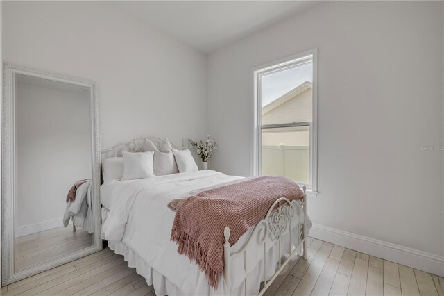 102 Inlet Shores Dr, New Smyrna Beach, FL 32168 - bedroom with wood finished floors and baseboards