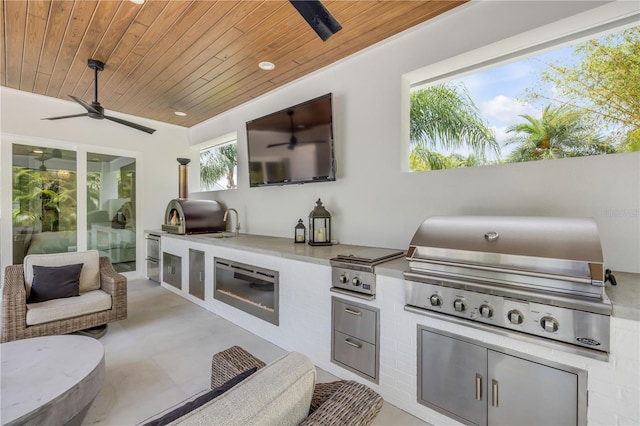 102 Inlet Shores Dr, New Smyrna Beach, FL 32168 - view of patio / terrace featuring grilling area, ceiling fan, exterior kitchen, and a sink