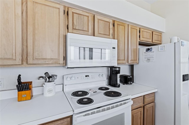 6320 S Atlantic Ave, New Smyrna Beach, FL 32169 - kitchen featuring white appliances, light countertops, and light brown cabinetry