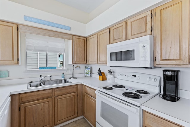 6320 S Atlantic Ave, New Smyrna Beach, FL 32169 - kitchen with white appliances, a sink, light countertops, and light brown cabinetry