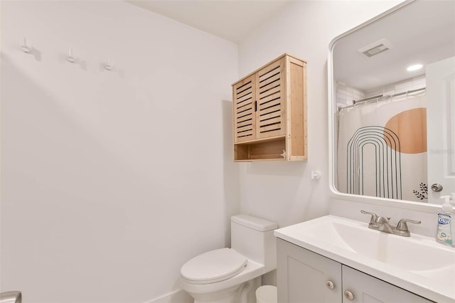833 E 12th Ave, New Smyrna Beach, FL 32169 - full bathroom featuring toilet, vanity, and curtained shower