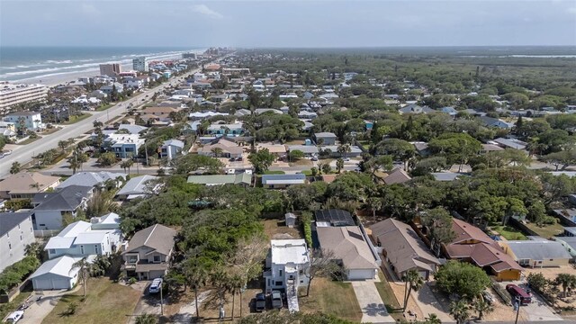 833 E 12th Ave, New Smyrna Beach, FL 32169 - aerial view of property and surrounding area with nearby suburban area and a large body of water