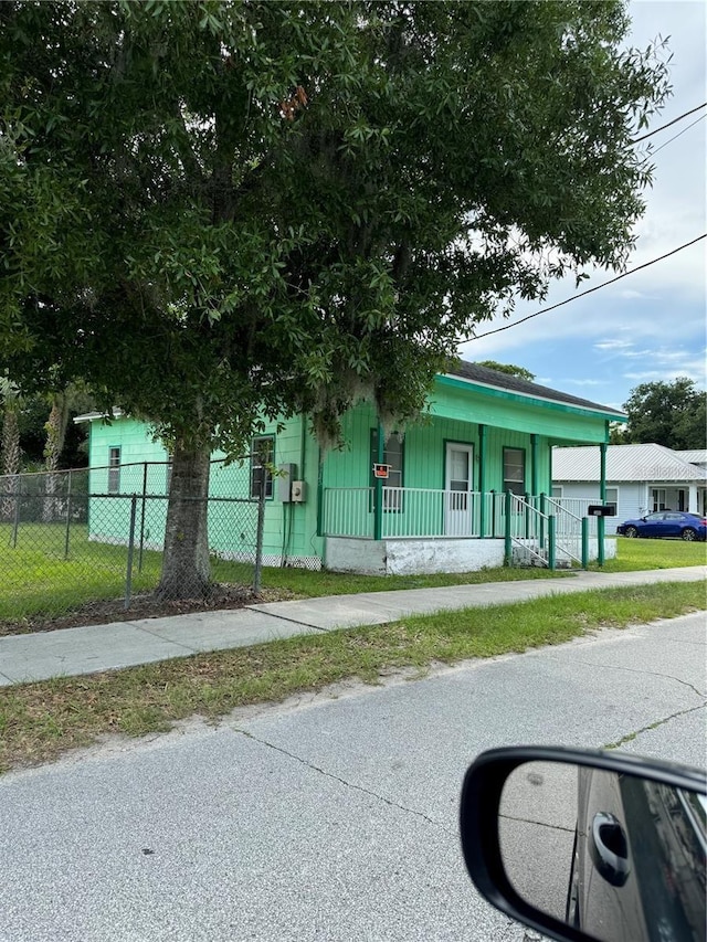 306 Sheldon St, New Smyrna Beach, FL 32168 - view of front of home featuring a porch