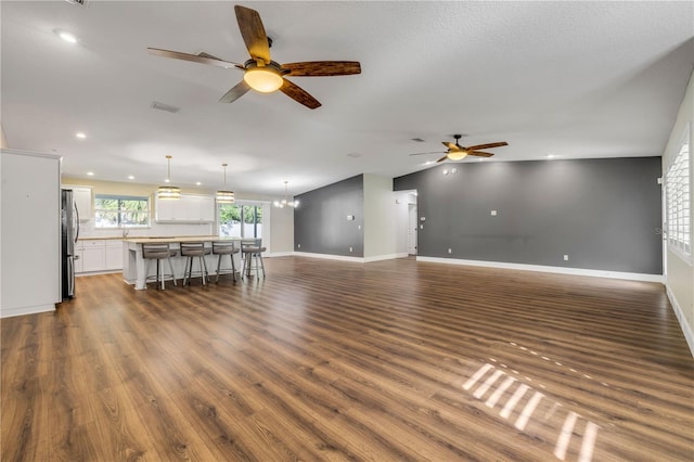 1144 Corbin Park Rd, New Smyrna Beach, FL 32168 - living area featuring ceiling fan, recessed lighting, dark wood-style floors, baseboards, and a chandelier