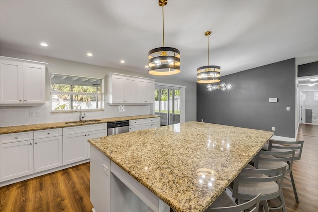 1144 Corbin Park Rd, New Smyrna Beach, FL 32168 - kitchen featuring a sink, dark wood finished floors, a center island, dishwasher, and recessed lighting