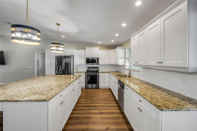 1144 Corbin Park Rd, New Smyrna Beach, FL 32168 - kitchen with appliances with stainless steel finishes, a sink, recessed lighting, decorative backsplash, and white cabinets