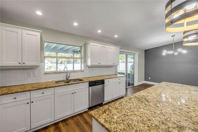 1144 Corbin Park Rd, New Smyrna Beach, FL 32168 - kitchen with stainless steel dishwasher, a sink, dark wood-type flooring, white cabinets, and recessed lighting