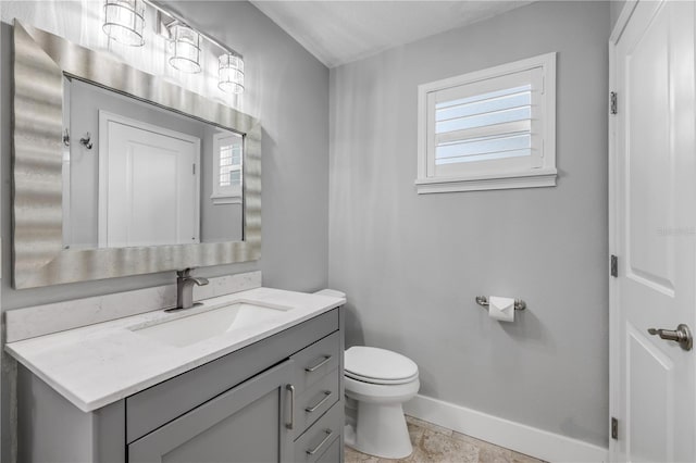 1144 Corbin Park Rd, New Smyrna Beach, FL 32168 - half bathroom with toilet, baseboards, and vanity