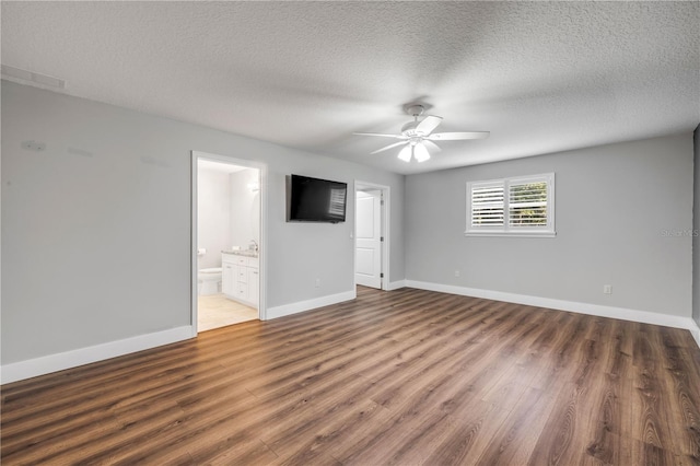 1144 Corbin Park Rd, New Smyrna Beach, FL 32168 - empty room featuring wood finished floors, a ceiling fan, a textured ceiling, and baseboards