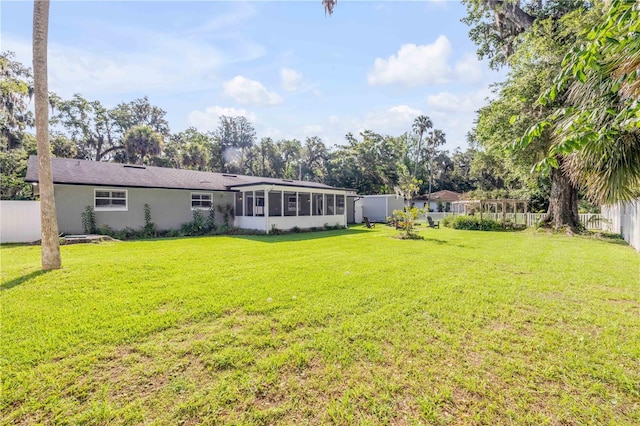 1144 Corbin Park Rd, New Smyrna Beach, FL 32168 - back of property with a sunroom and stucco siding