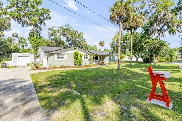 1144 Corbin Park Rd, New Smyrna Beach, FL 32168 - ranch-style house featuring an outdoor structure, concrete driveway, and a front yard
