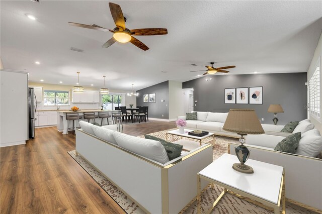 1144 Corbin Park Rd, New Smyrna Beach, FL 32168 - living area featuring ceiling fan, dark wood-type flooring, recessed lighting, and lofted ceiling