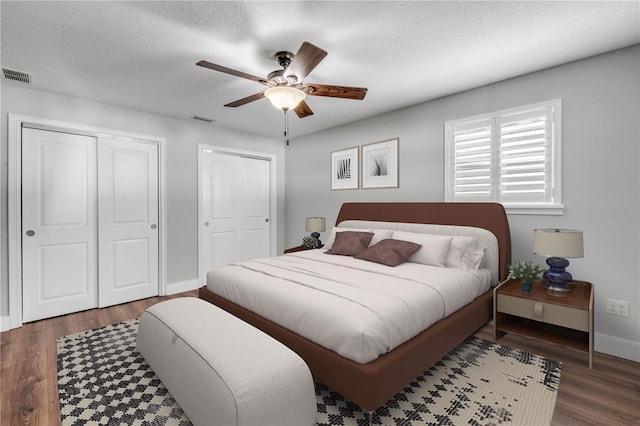1144 Corbin Park Rd, New Smyrna Beach, FL 32168 - bedroom with wood finished floors, ceiling fan, and a textured ceiling