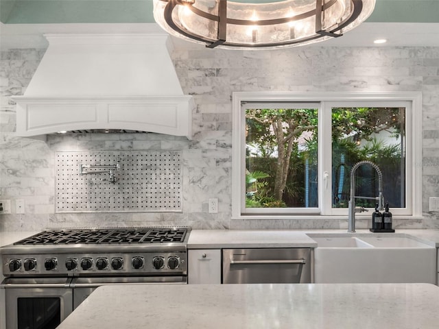 1215 Commodore Dr, New Smyrna Beach, FL 32168 - kitchen featuring appliances with stainless steel finishes, premium range hood, decorative backsplash, and white cabinetry