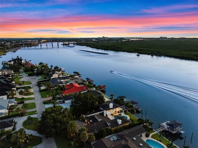 1215 Commodore Dr, New Smyrna Beach, FL 32168 - aerial overview of property's location with a large body of water and a notable bridge