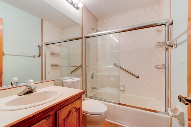 488 Shorewood Ln, New Smyrna Beach, FL 32168 - bathroom featuring toilet, combined bath / shower with glass door, and vanity