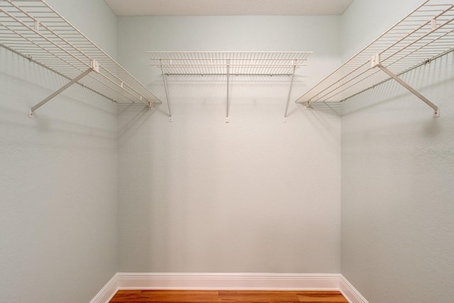 488 Shorewood Ln, New Smyrna Beach, FL 32168 - spacious closet featuring wood finished floors