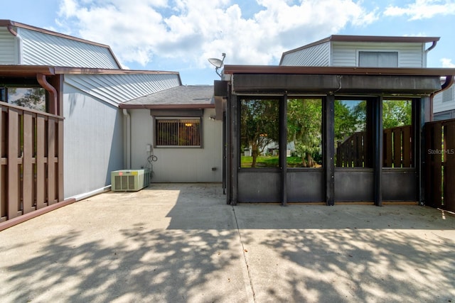 488 Shorewood Ln, New Smyrna Beach, FL 32168 - back of property featuring central air condition unit and a patio