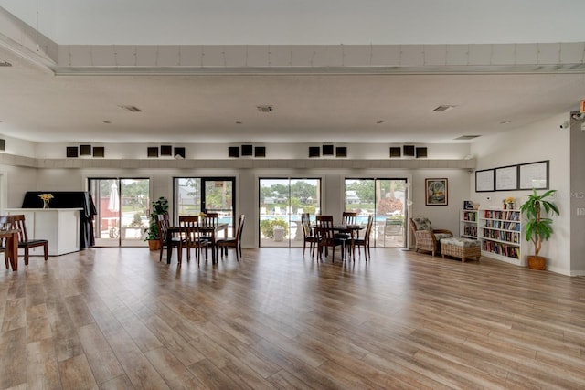 488 Shorewood Ln, New Smyrna Beach, FL 32168 - living room featuring light wood-style flooring and healthy amount of natural light