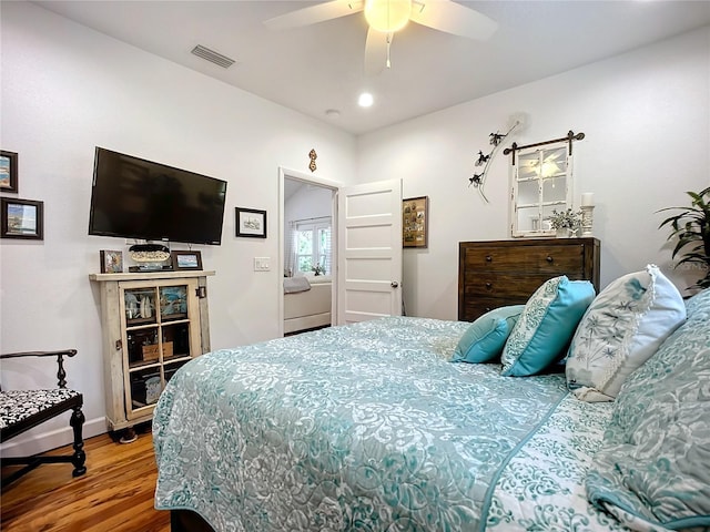 216 Murray St, New Smyrna Beach, FL 32168 - bedroom featuring wood finished floors, ceiling fan, and baseboards