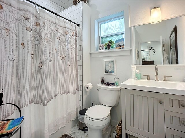 216 Murray St, New Smyrna Beach, FL 32168 - full bathroom featuring toilet, vanity, and shower / tub combo with curtain
