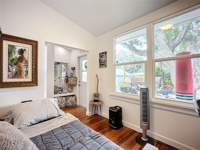 216 Murray St, New Smyrna Beach, FL 32168 - bedroom with lofted ceiling, wood finished floors, and baseboards