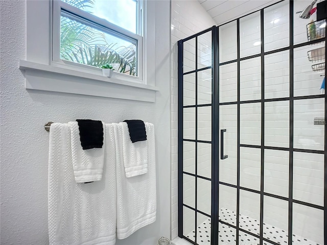 216 Murray St, New Smyrna Beach, FL 32168 - full bathroom with a shower stall and a textured wall