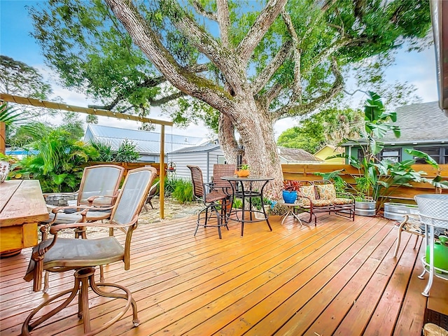 216 Murray St, New Smyrna Beach, FL 32168 - wooden deck with outdoor dining area