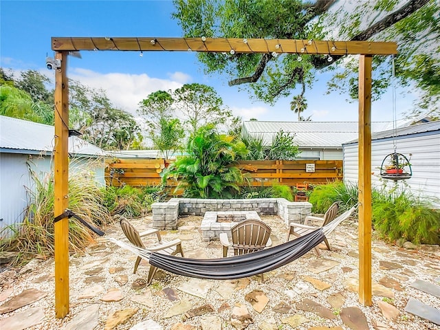 216 Murray St, New Smyrna Beach, FL 32168 - view of patio featuring an outdoor fire pit