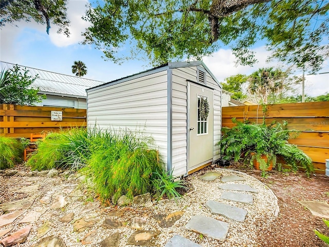 216 Murray St, New Smyrna Beach, FL 32168 - view of shed featuring a fenced backyard