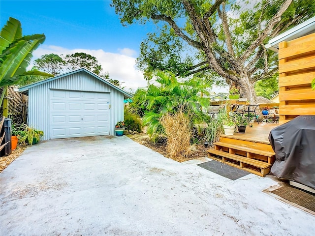 216 Murray St, New Smyrna Beach, FL 32168 - detached garage featuring driveway