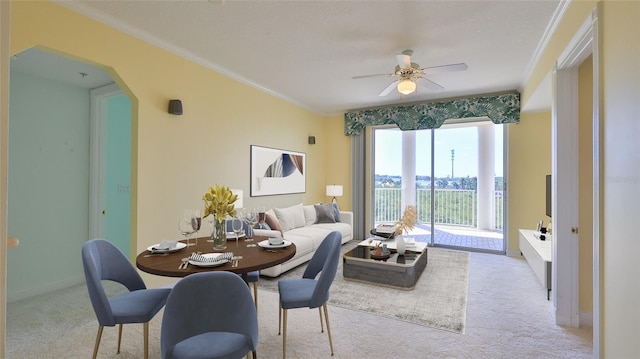 4620 Riverwalk Village Ct Unit 7306, Ponce Inlet, FL 32127 - carpeted dining space featuring arched walkways, a ceiling fan, ornamental molding, and baseboards