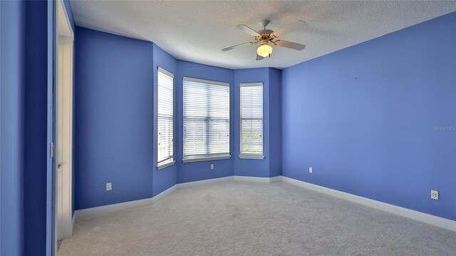 4620 Riverwalk Village Ct Unit 7306, Ponce Inlet, FL 32127 - carpeted spare room featuring a ceiling fan, a textured ceiling, and baseboards