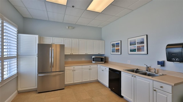 4620 Riverwalk Village Ct Unit 7306, Ponce Inlet, FL 32127 - kitchen featuring appliances with stainless steel finishes, a sink, a paneled ceiling, white cabinetry, and light countertops