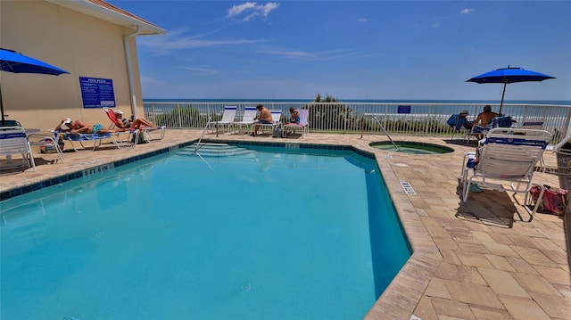 4620 Riverwalk Village Ct Unit 7306, Ponce Inlet, FL 32127 - community pool featuring a hot tub, a water view, and a patio area
