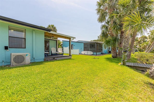 76 Heather Point Ct, New Smyrna Beach, FL 32169 - view of grassy yard with a sunroom and a cooling unit