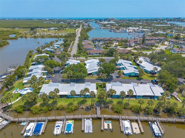 76 Heather Point Ct, New Smyrna Beach, FL 32169 - aerial view of property and surrounding area featuring a large body of water and nearby suburban area