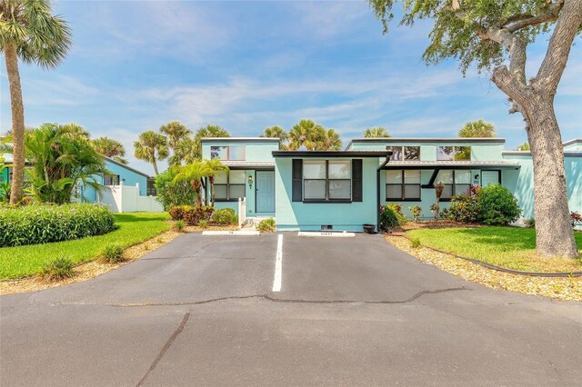 76 Heather Point Ct, New Smyrna Beach, FL 32169 - view of front of property featuring uncovered parking and stucco siding