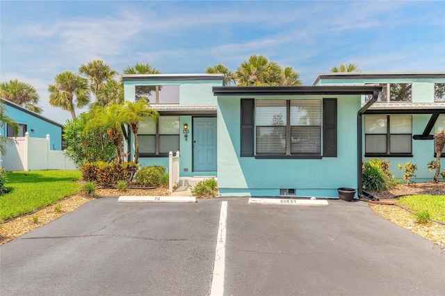 76 Heather Point Ct, New Smyrna Beach, FL 32169 - view of front of home featuring uncovered parking and stucco siding