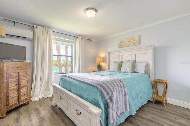 76 Heather Point Ct, New Smyrna Beach, FL 32169 - bedroom featuring an AC wall unit, dark wood-style flooring, and baseboards