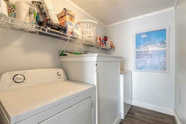 76 Heather Point Ct, New Smyrna Beach, FL 32169 - washroom with crown molding, washer and clothes dryer, dark wood-style flooring, and baseboards