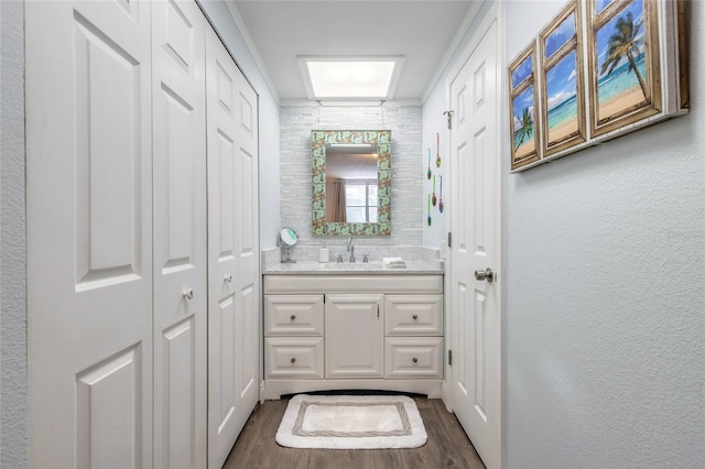 76 Heather Point Ct, New Smyrna Beach, FL 32169 - bathroom featuring a closet, wood finished floors, and vanity