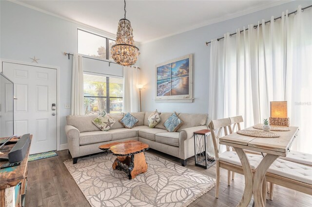76 Heather Point Ct, New Smyrna Beach, FL 32169 - living room featuring a chandelier, crown molding, and wood finished floors