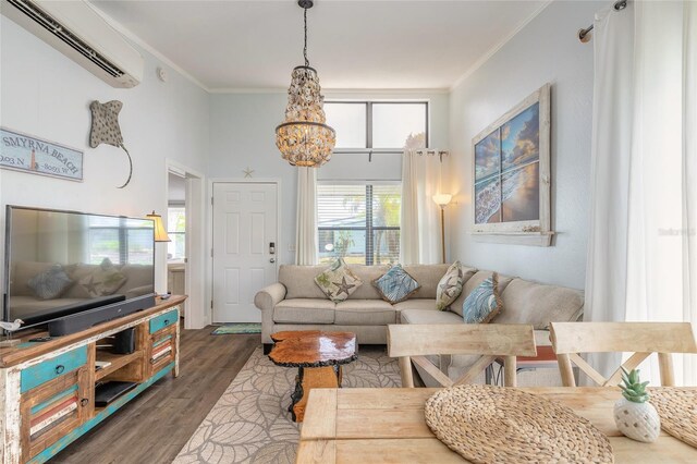 76 Heather Point Ct, New Smyrna Beach, FL 32169 - living room with a wall unit AC, wood finished floors, ornamental molding, and a chandelier
