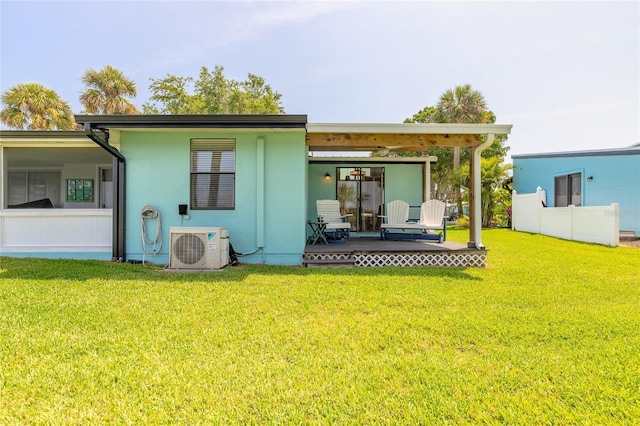76 Heather Point Ct, New Smyrna Beach, FL 32169 - rear view of property with a lawn, a cooling unit, and stucco siding